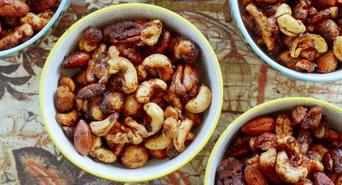 bowl of aked Savoury nuts with herbies spices